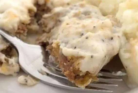 Country Fried Steak topped with white gravy and served with mashed potatoes and vegetable of the day.