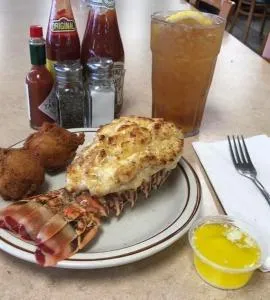10oz/12oz Lobster tail with 2 sides, and 2 homemade hush puppies
